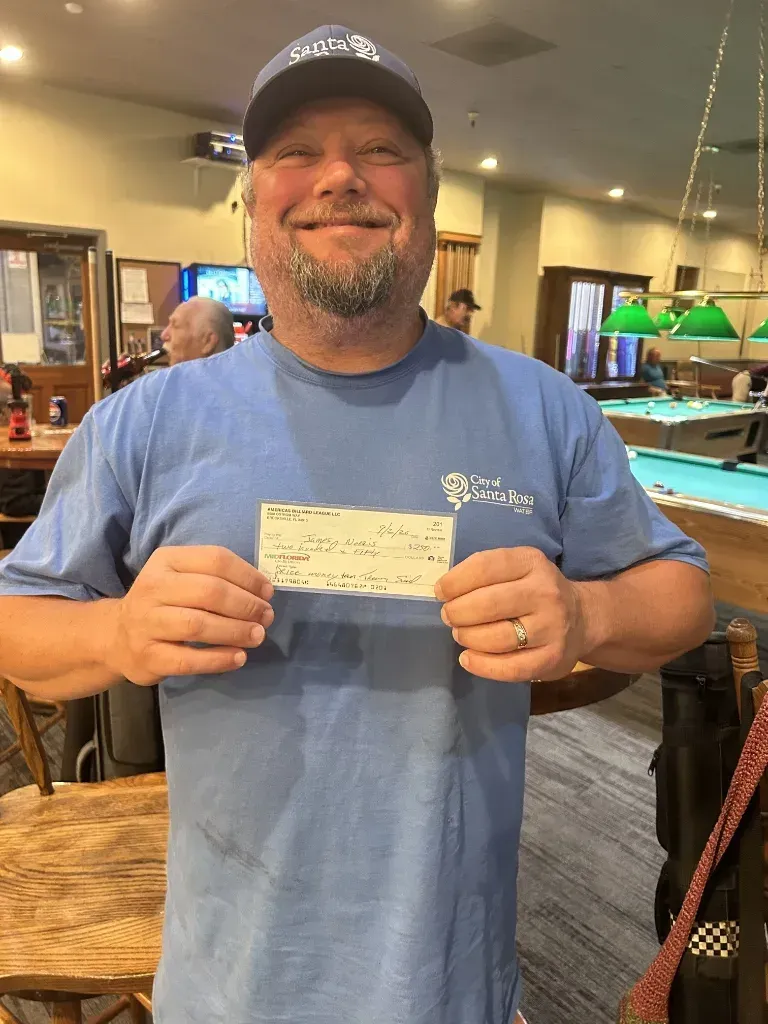 James Norris receiving his $250 playoff prize check for qualifying and competing in the playoffs