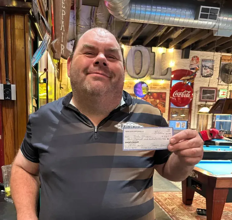 Josh “Shrek” proudly holding his $4,167 championship winning check